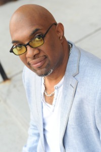A person wearing glasses and looking at the camera

Description automatically generated